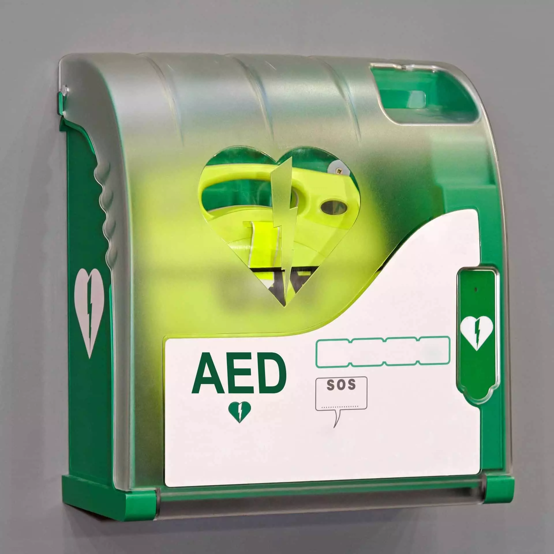 Boîtier mural vert pour défibrillateur automatisé externe (DAE) avec symbole cœur et bouton SOS